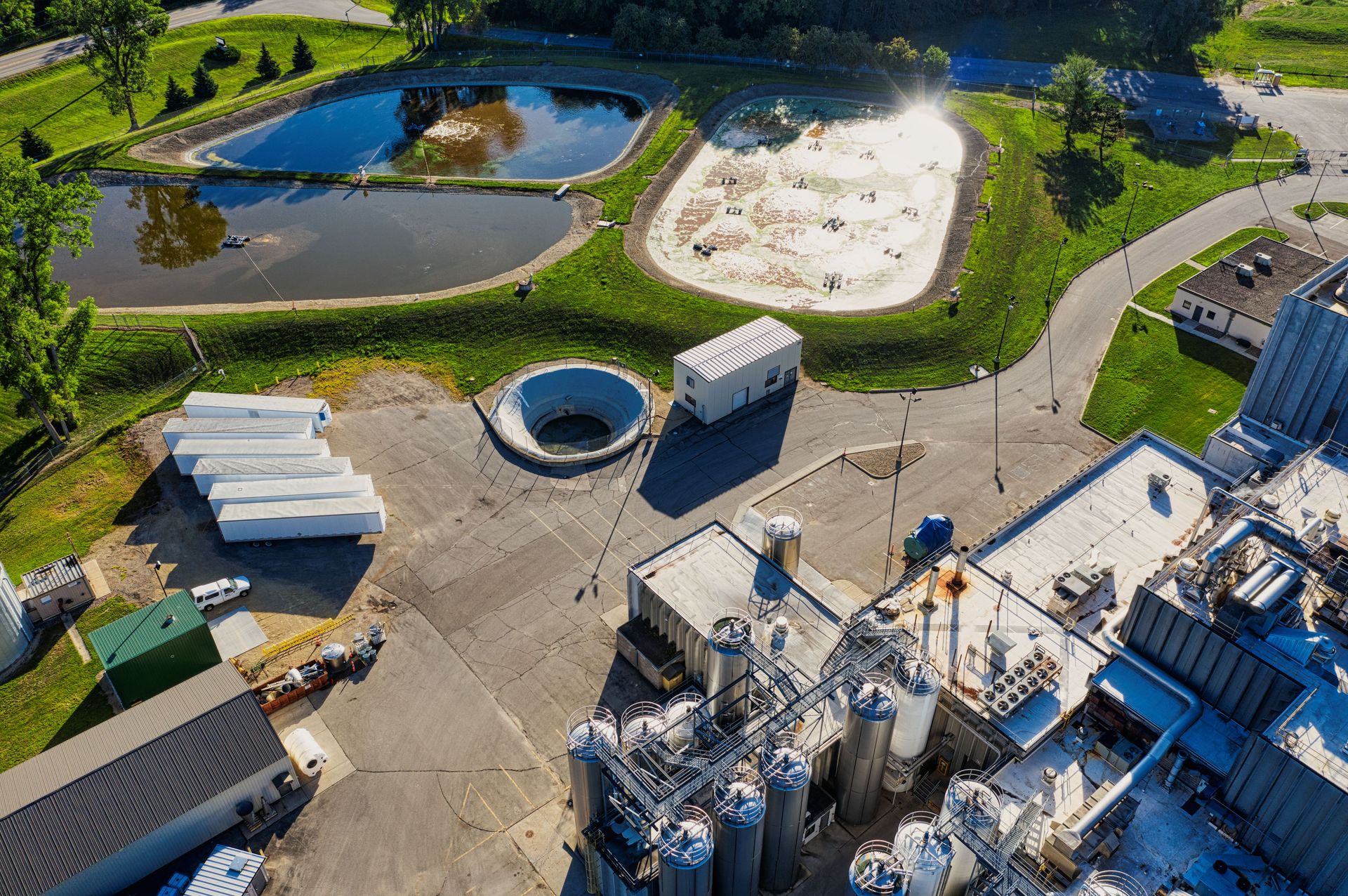 Aerial shot of a factory complex with reflective ponds in Bay City, WI.